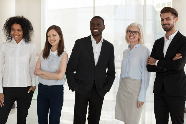 istock Happy diverse company staff standing posing shooting indoors 1125942572