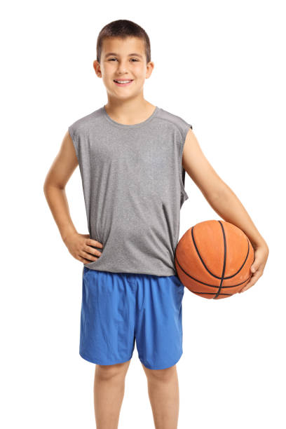 istock Smiling boy posing with a basketball 1125942699