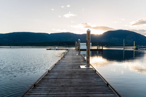 istock Empty Wooden Jetty in a Harbour on a Lake at Sunset 1125944465