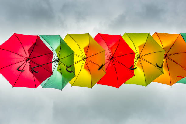flying umbrellas and gray sky