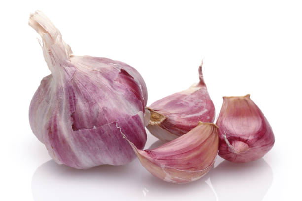 istock Whole garlic and garlic cloves isolated on white background 1125947004
