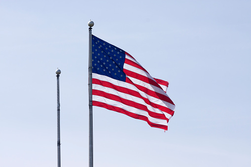 American flag waving in clear sky
