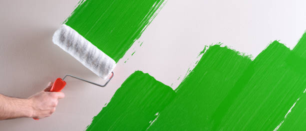 istock Concept of hand painting green sample on wall 1125947467