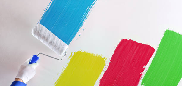 istock Concept of professional hand painting multicolored samples on wall 1125947482