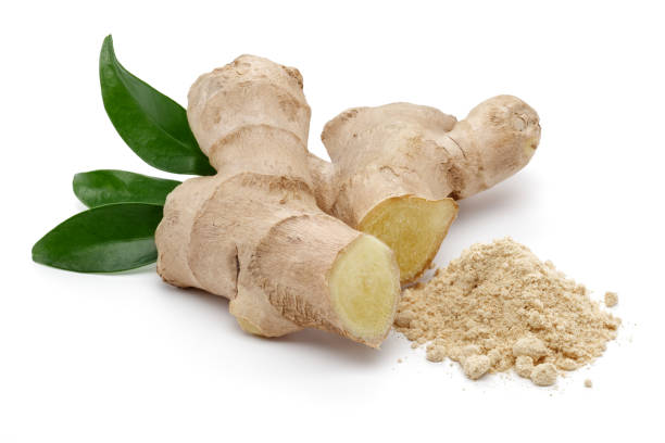 Fresh ginger root with leaves and powder