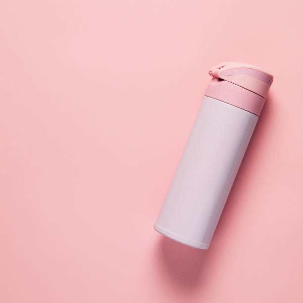 istock Pink thermos on pink background 1125948085
