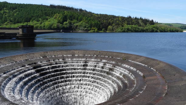 istock Ladybower Reservoir Spillway flowing 1125949637