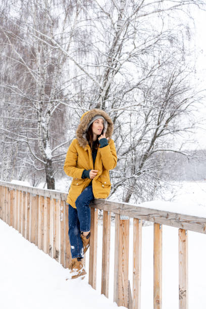 istock Girl in winter forest 1125950056