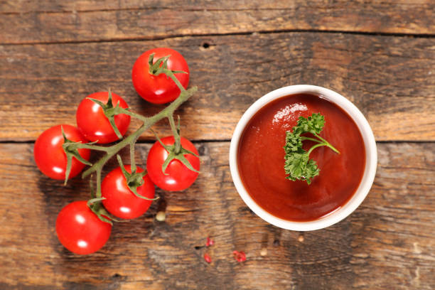 istock tomato sauce on wood background 1125950134