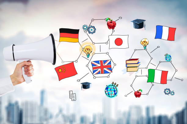 istock Hand with megaphone, international education, city 1125950600