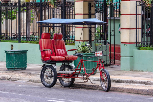 istock typical bici taxi, Cuban rickshaw , Havanna, Cuba 1125951261