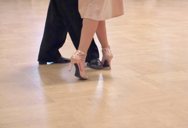 istock Graceful dance couple tangoing at the ballroom. 1125951821