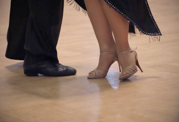 istock Graceful dance couple tangoing at the ballroom. 1125951859