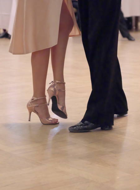 istock Graceful dance couple tangoing at the ballroom. 1125951906