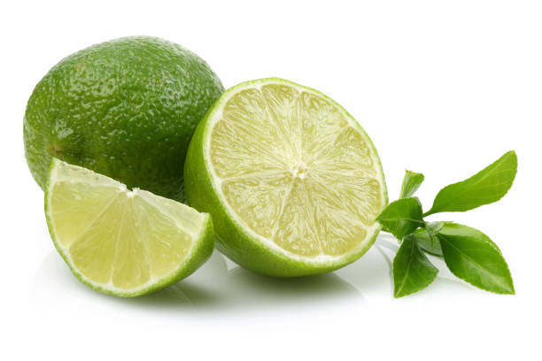 istock Sliced fresh lime fruits with leaves 1125952949