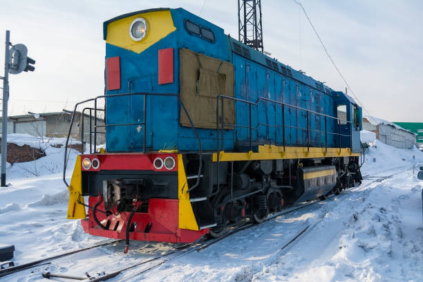 istock Blue locomotive on tracks in the winter 1125955464