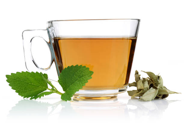 istock Melissa tea in a glass cup and green lemon balm leaves 1125955476