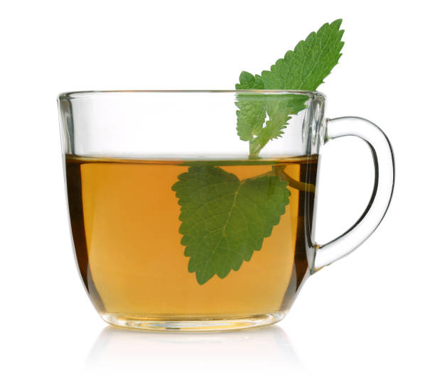 istock Melissa tea in a glass cup and green lemon balm leaves 1125955534