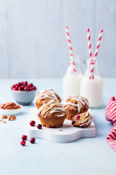 istock Muffins, cakes with cranberry and pecan nuts. Christmas decoration. Copy space. 1125956337