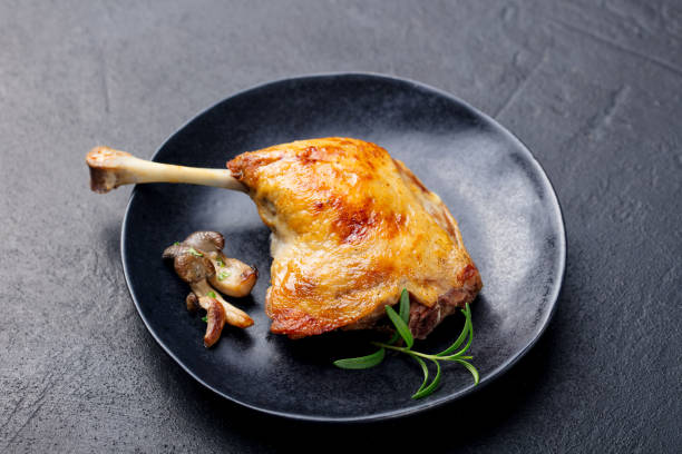 istock Duck legs confit with mushroom sauce . Restaurant serving. Close up. 1125956388
