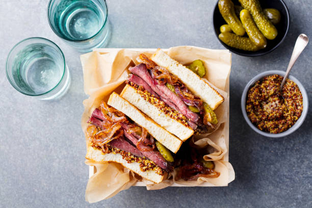 Sandwich with roast beef in wooden box Sandwich with roast beef in wooden box. Top view pastrami photos stock pictures, royalty-free photos & images