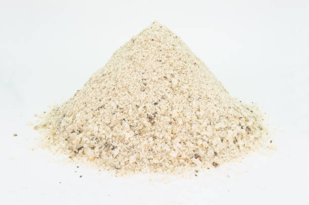 istock Heap of industrial salt to pour on the streets with medium grain, isolated on white. 1125957504