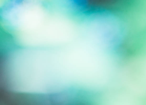 istock Defocused Abstract Background Blue Green.Blue glowing holiday blurred background. 1125957604