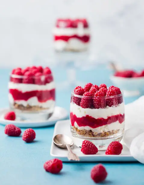 Raspberry dessert, cheesecake, trifle mouse in a glass. Close up