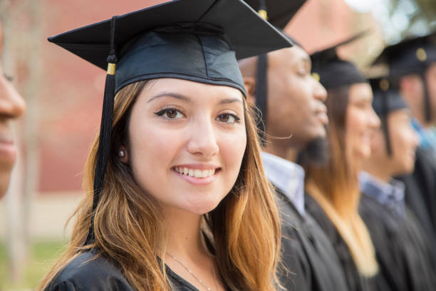 istock Latin descent female college student graduation on campus. 1125957885