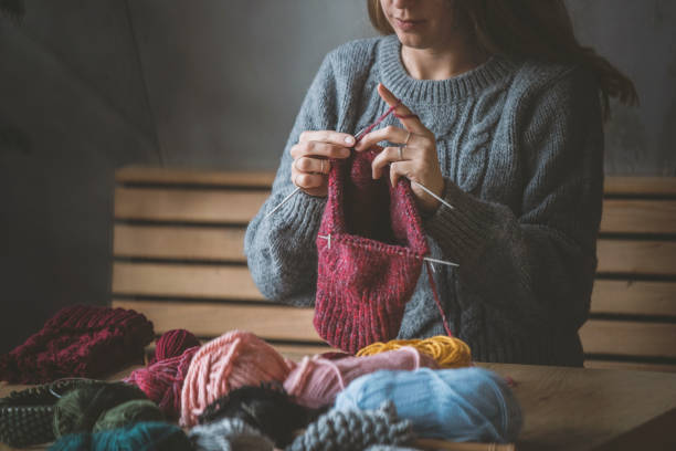 istock Close up on woman's hands knitting 1125957986