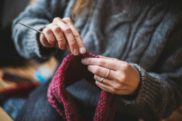 istock Close up on woman's hands knitting 1125957989