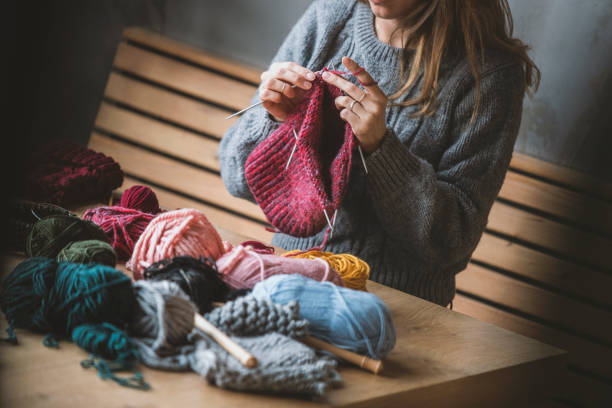 istock Close up on woman's hands knitting 1125957993