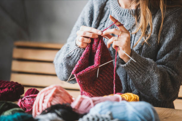 istock Close up on woman's hands knitting 1125958000