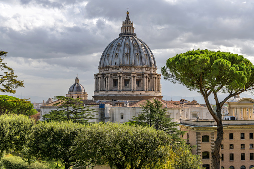 Vatican City, Rome, Italy - October 2, 2018: A cloudy morning view of St. Peter's Basilica, as seen from Vatican Gardens.
