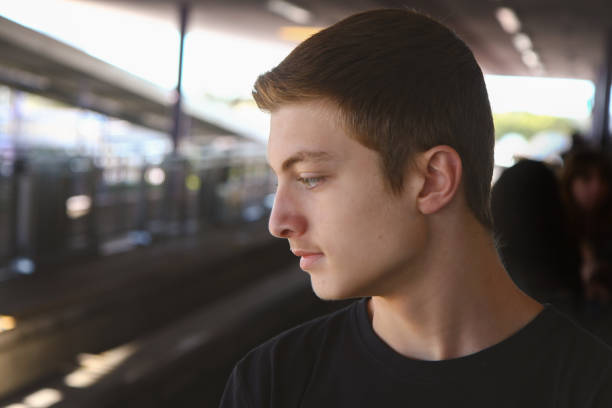 istock Teenage Boy At Railway Station 1125961265