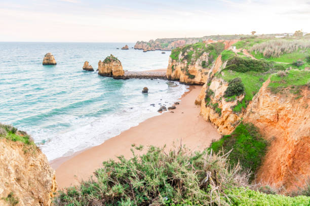 istock Beautiful cliffs in Pinhao Beach, Lagos, Portugal 1125964433