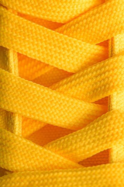 istock Yellow sneakers shoelaces 1125964706
