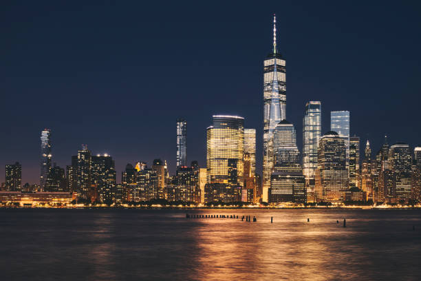 istock New York City business district skyline at night. 1125965978