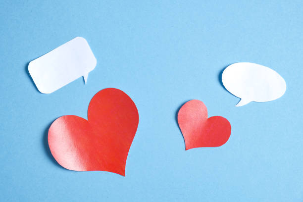 istock Several red hearts from paper with balloon on a blue background. 1125966895