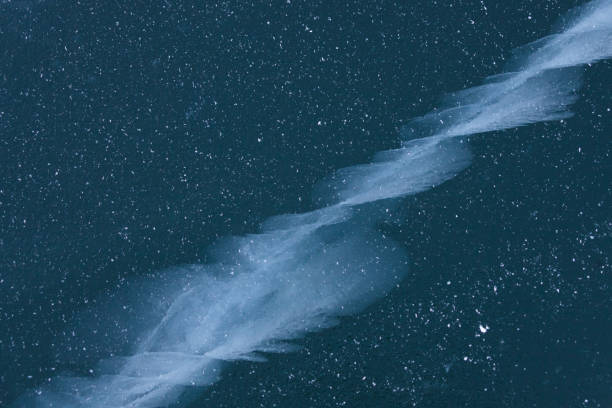 istock Cracks in ice of Baikal lake.  Winter texture 1125967717