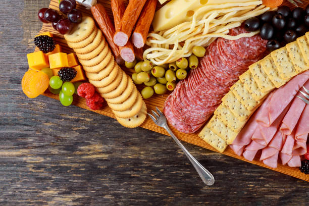 istock Party appetizer plate consisting of cheese, crackers, nuts, and other party snacks. 1125969185