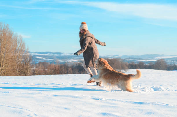 istock Girl with her golden retriever 1125970133