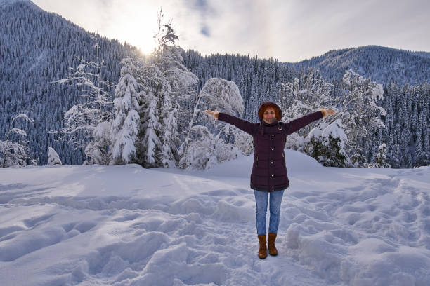 istock Happy lady in winter holiday 1125973304