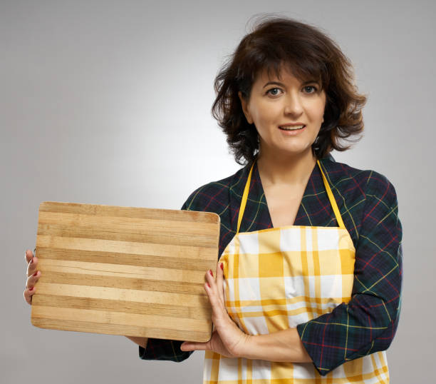 istock Woman holding a wooden board 1125973450