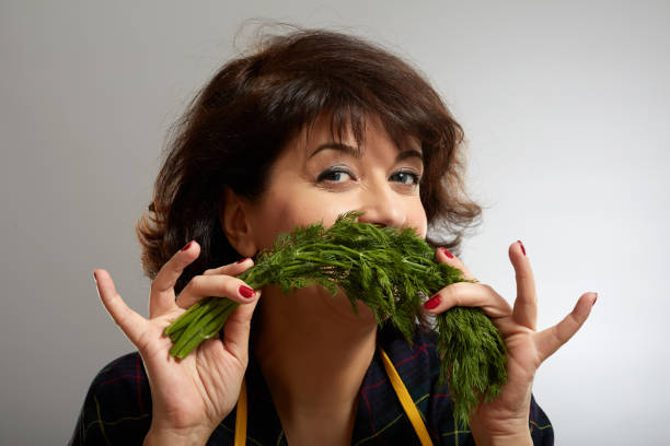 istock Woman holding a bunch of dill 1125973719