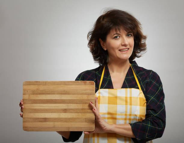 istock Woman holding a wooden board 1125973782