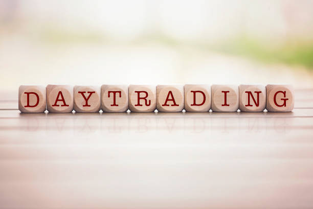 istock Day Trading written on cube wooden blocks. 1125976536