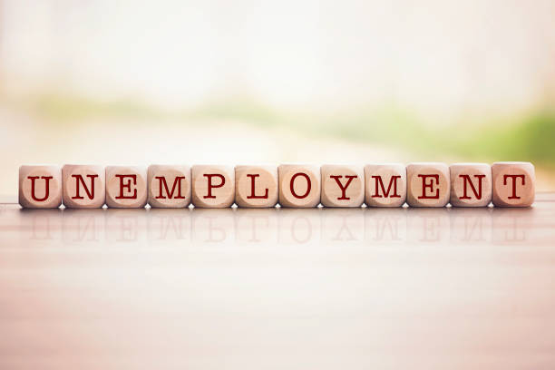 istock Unemployment written on cube wooden blocks. 1125977320