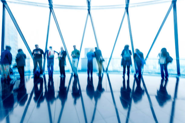 istock Abstract Blue Silhouettes of People and Their Shadows Against Light 1125980188