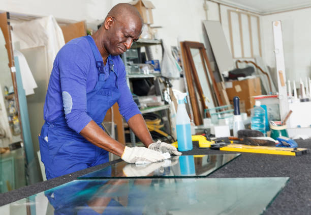 istock Experienced African American craftsman cleaning cut glass on table 1125980243